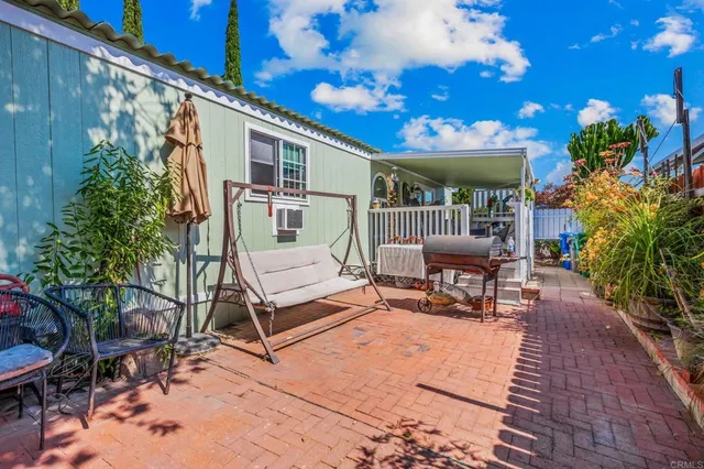 a outdoor living space with furniture and a potted plant