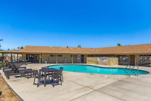 a view of a chairs and table in the patio