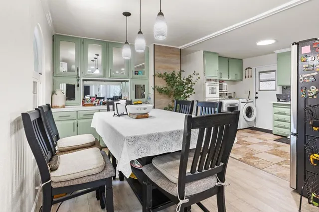 a dining room with furniture and window