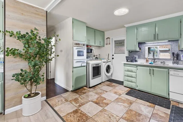 a kitchen with a refrigerator and a sink
