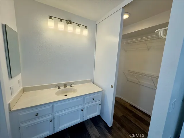 a bathroom with a sink and mirror