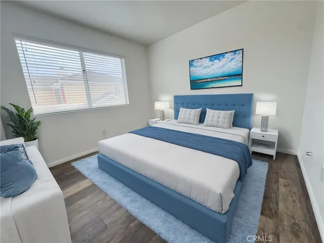 a bedroom with bed and window