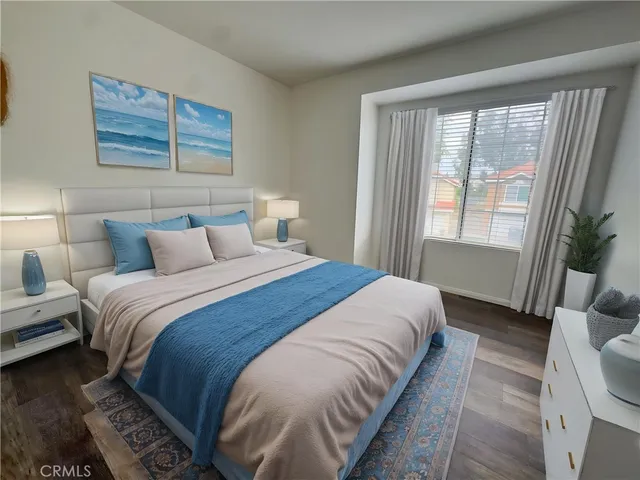 a bedroom with bed and a window