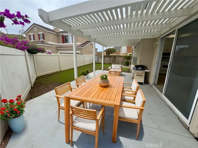 a dining room with furniture window and wooden floor