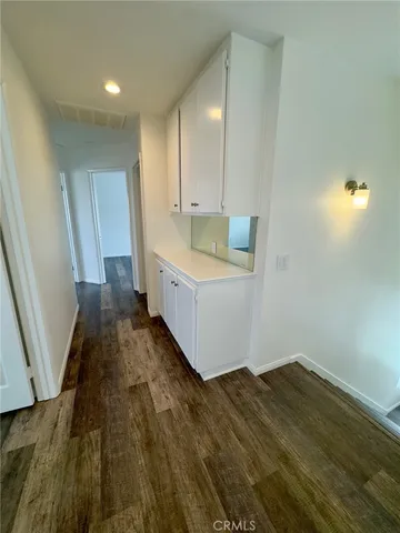 a view of a kitchen with wooden floor