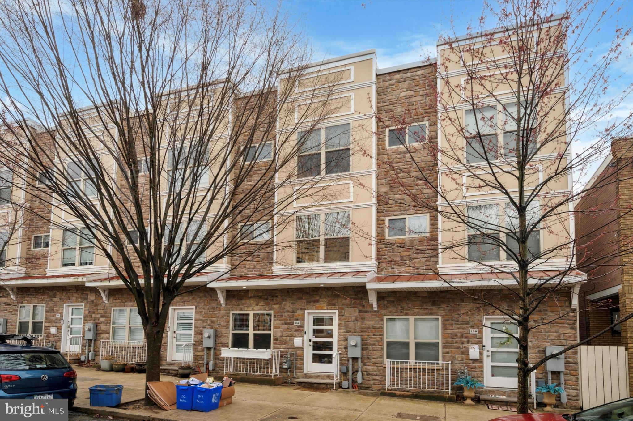 152 Kalos Street Philadelphia, PA 19128 - Photo 1 of 26 a front view of a building with lot of windows