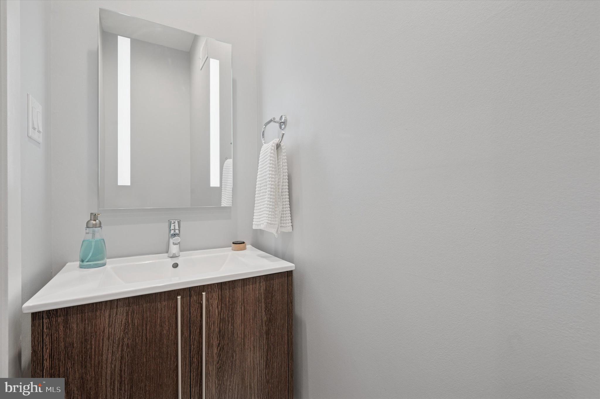 152 Kalos Street Philadelphia, PA 19128 - Photo 11 of 26 a bathroom with a sink and a mirror