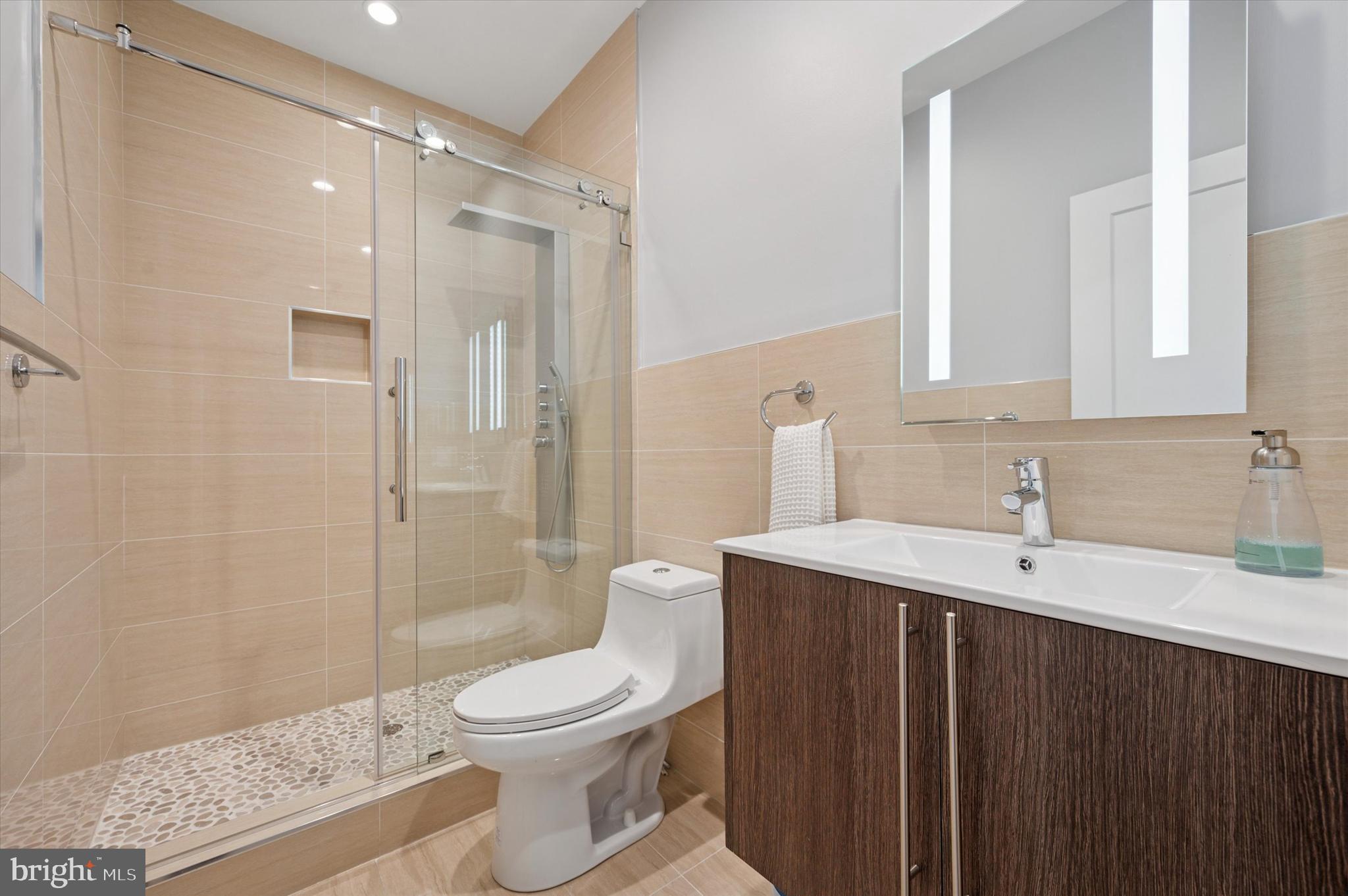 152 Kalos Street Philadelphia, PA 19128 - Photo 22 of 26 a bathroom with a sink a toilet and shower
