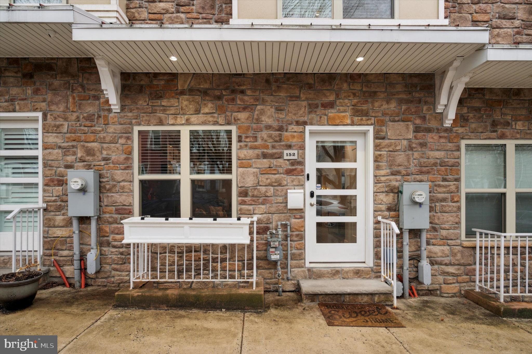 152 Kalos Street Philadelphia, PA 19128 - Photo 23 of 26 a view of a brick house with a window