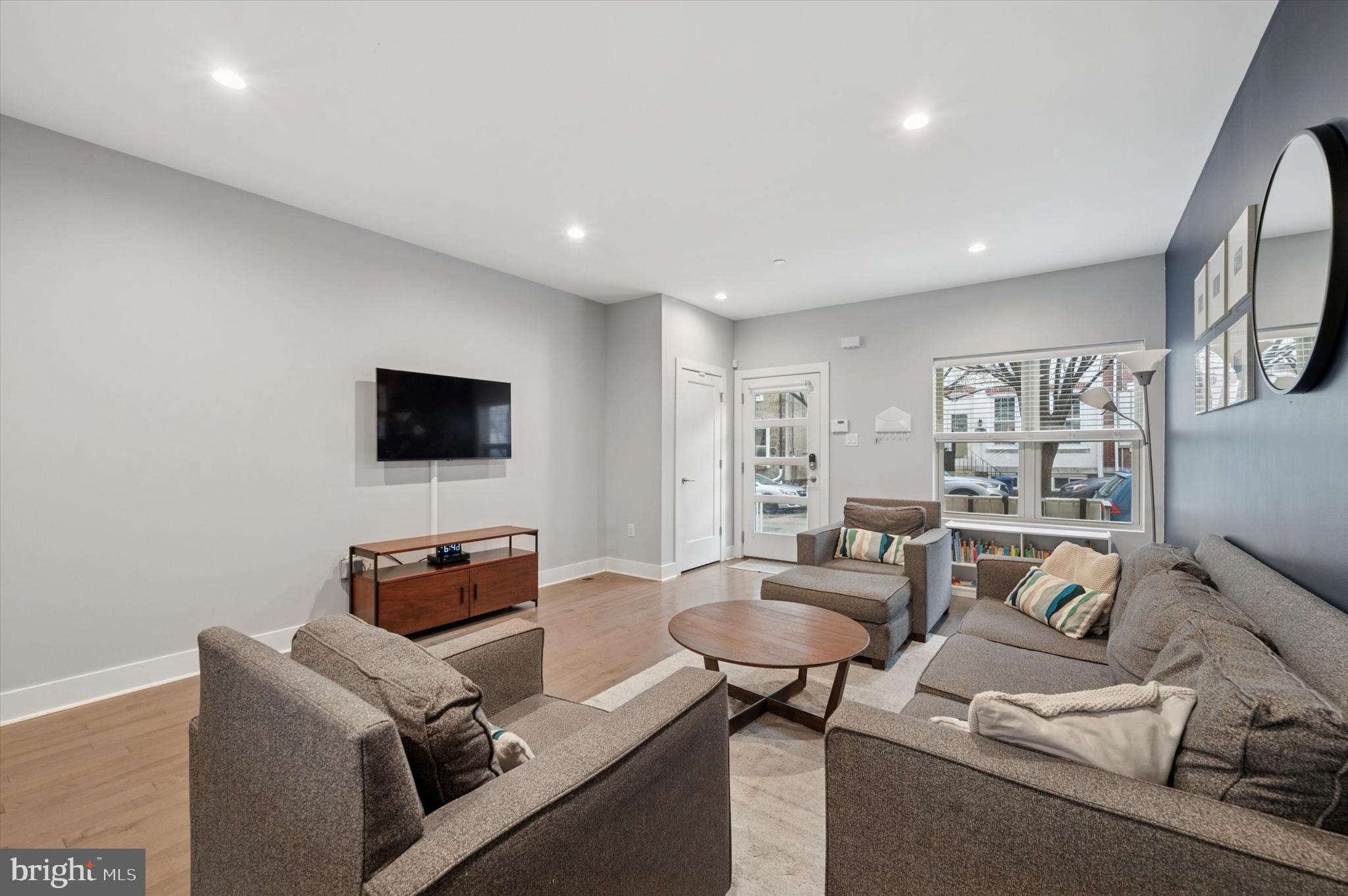 152 Kalos Street Philadelphia, PA 19128 - Photo 6 of 26 a living room with furniture and a flat screen tv