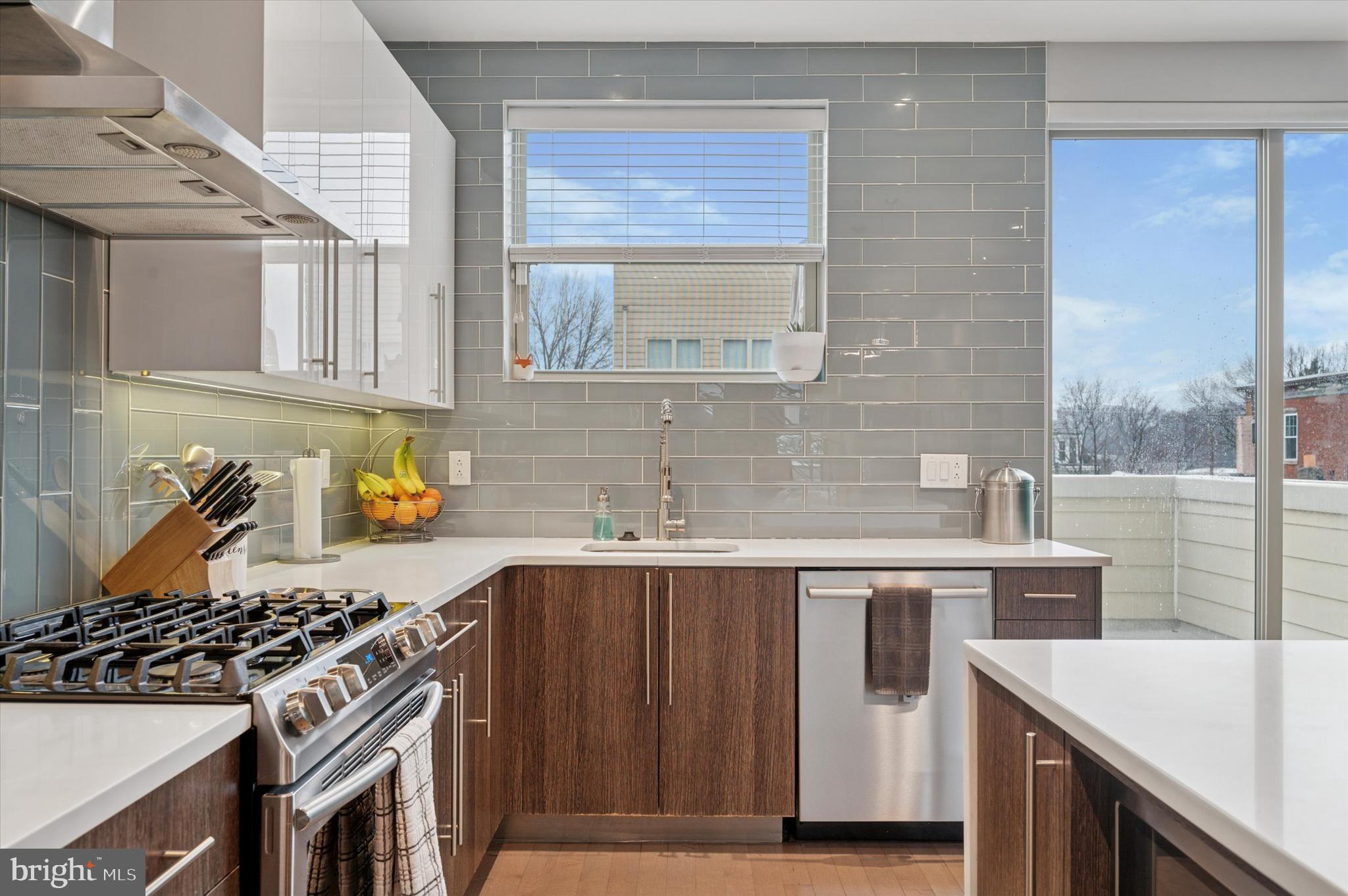 152 Kalos Street Philadelphia, PA 19128 - Photo 8 of 26 a kitchen with a sink stove and cabinets
