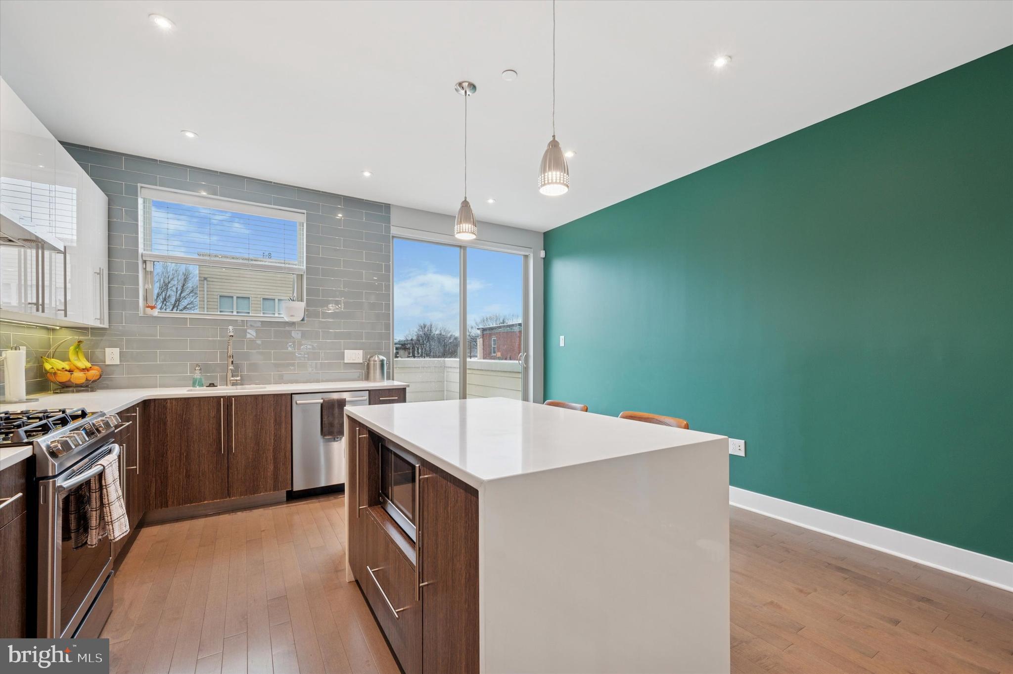 152 Kalos Street Philadelphia, PA 19128 - Photo 9 of 26 a kitchen with a sink and a stove top oven