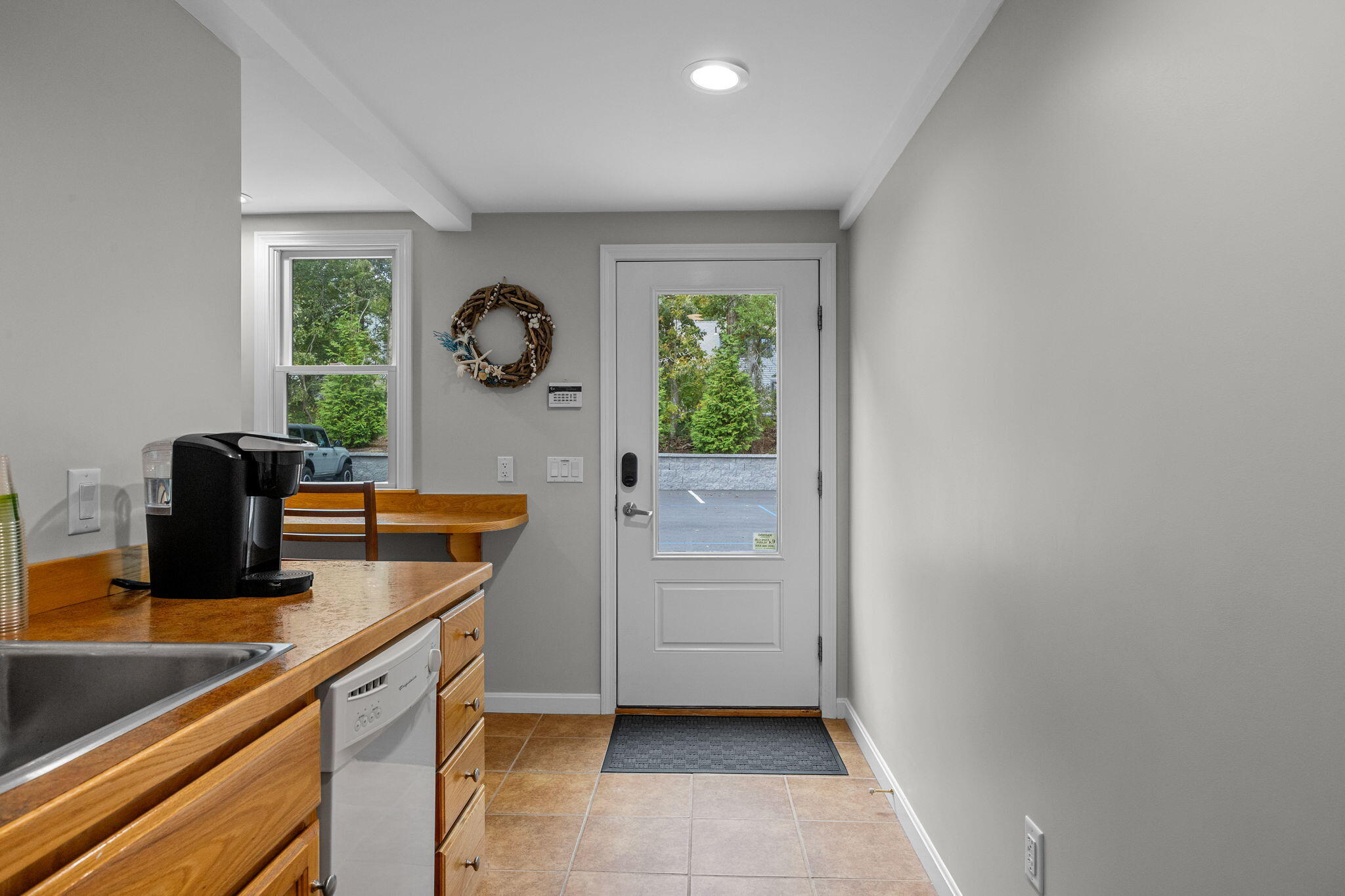 29 West Road Orleans, MA 02653 - Photo 22 of 27 a view of cabinets with wooden floor and a window