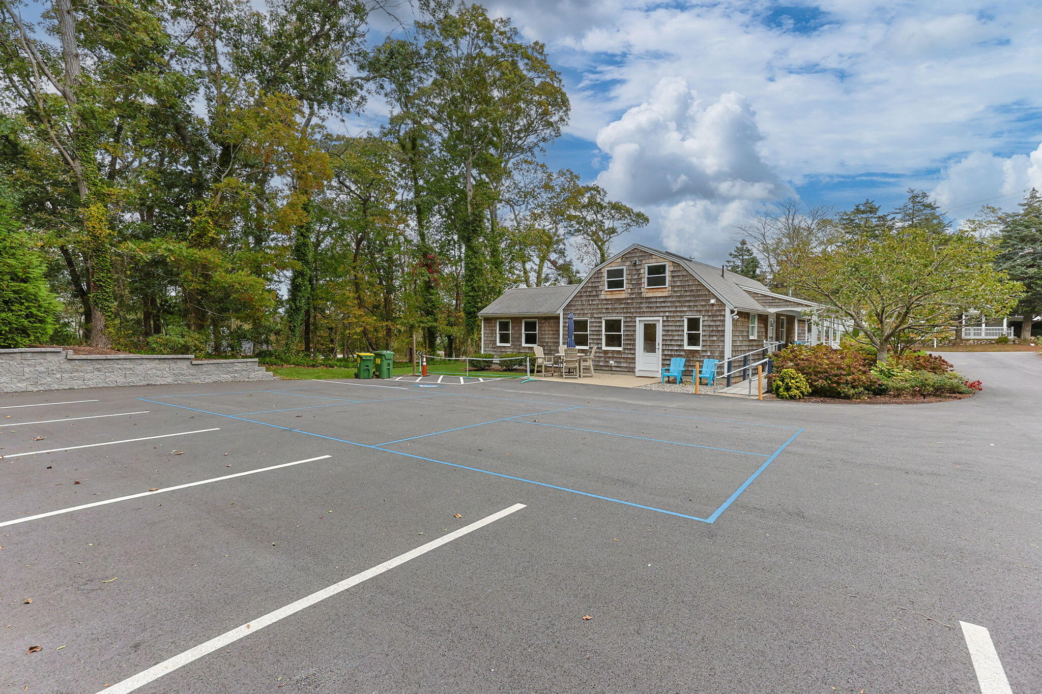 29 West Road Orleans, MA 02653 - Photo 10 of 27 a front view of a house with a garden
