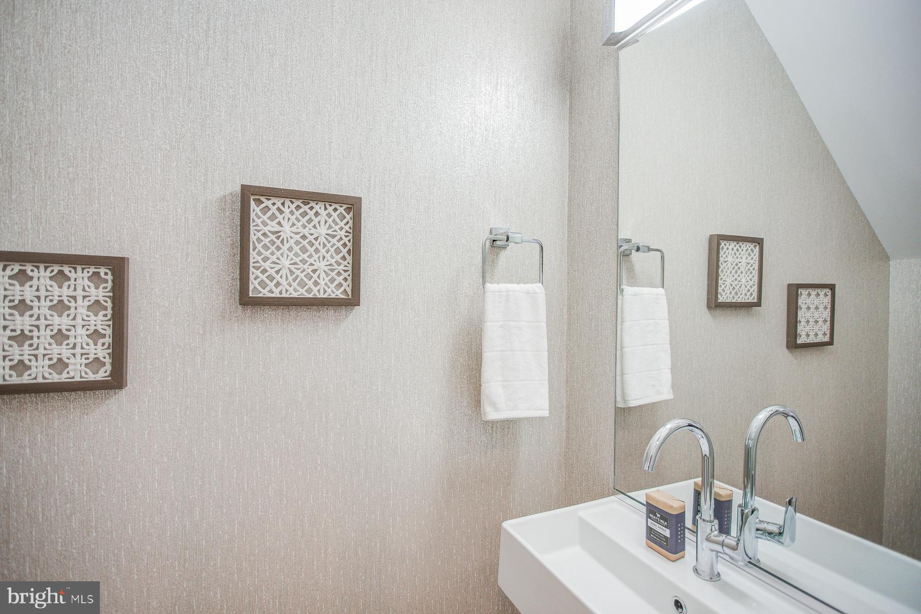 2024 16th Street Northwest, Unit C Washington, DC 20009 - Photo 18 of 27 a bathroom with a sink and a mirror