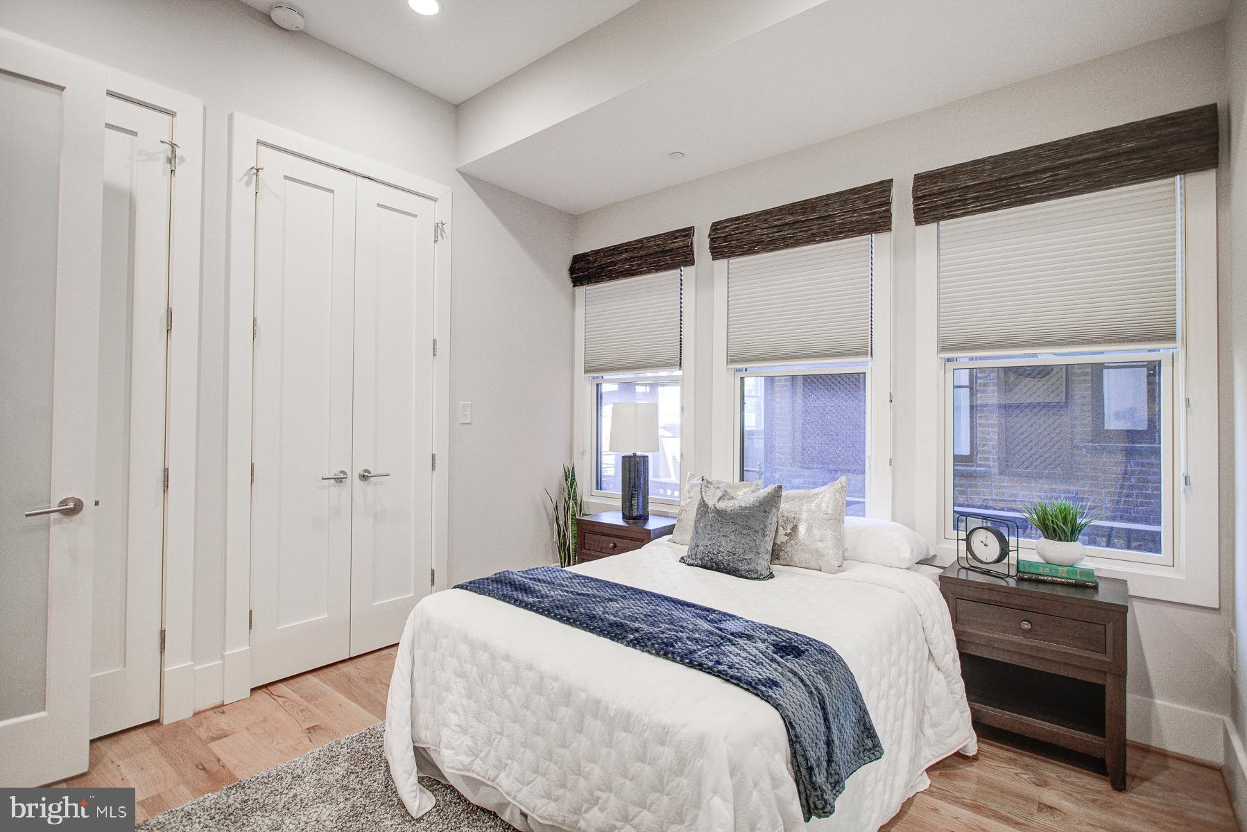 2024 16th Street Northwest, Unit C Washington, DC 20009 - Photo 20 of 27 a bedroom with a large bed and a window