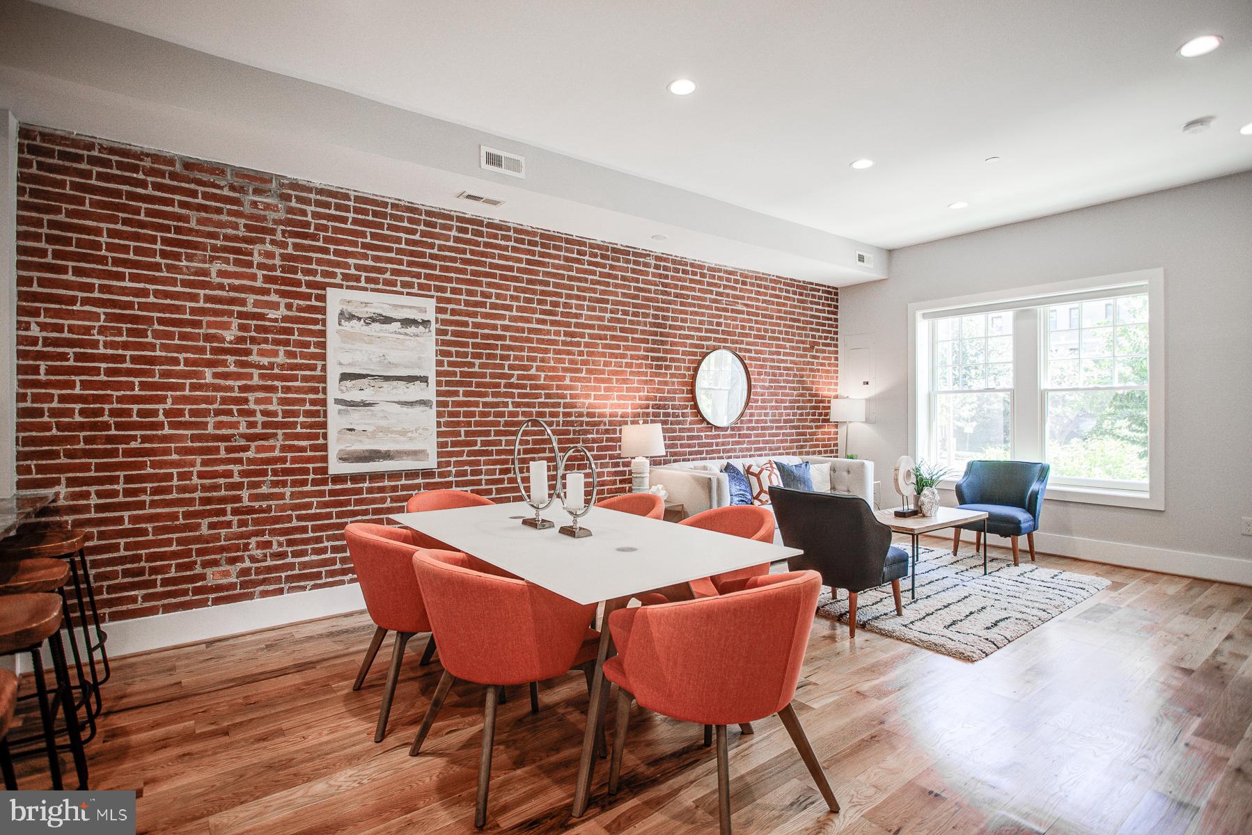 2024 16th Street Northwest, Unit C Washington, DC 20009 - Photo 2 of 27 a view of a dining room with furniture window and wooden floor
