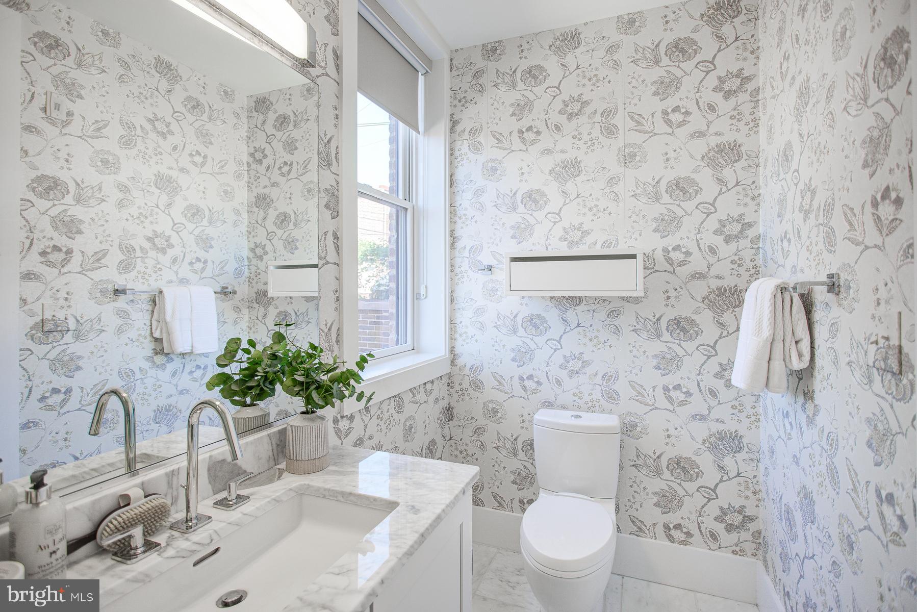 2024 16th Street Northwest, Unit C Washington, DC 20009 - Photo 27 of 27 a bathroom with a sink a toilet and a mirror