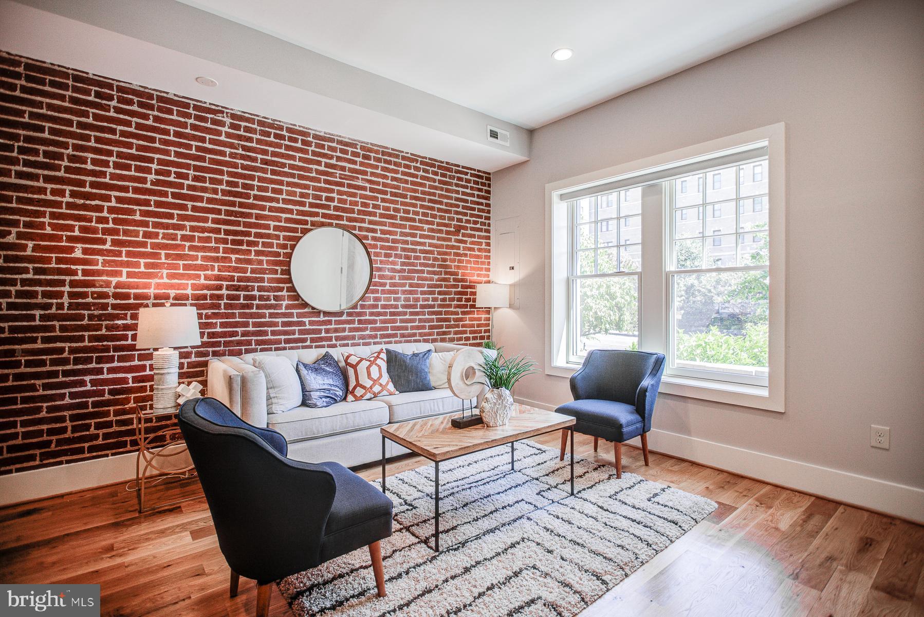 2024 16th Street Northwest, Unit C Washington, DC 20009 - Photo 3 of 27 a living room with furniture and a window