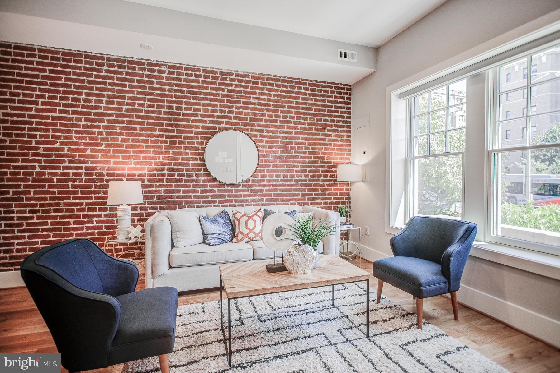 2024 16th Street Northwest, Unit C Washington, DC 20009 - Photo 4 of 27 a living room with furniture and a large window