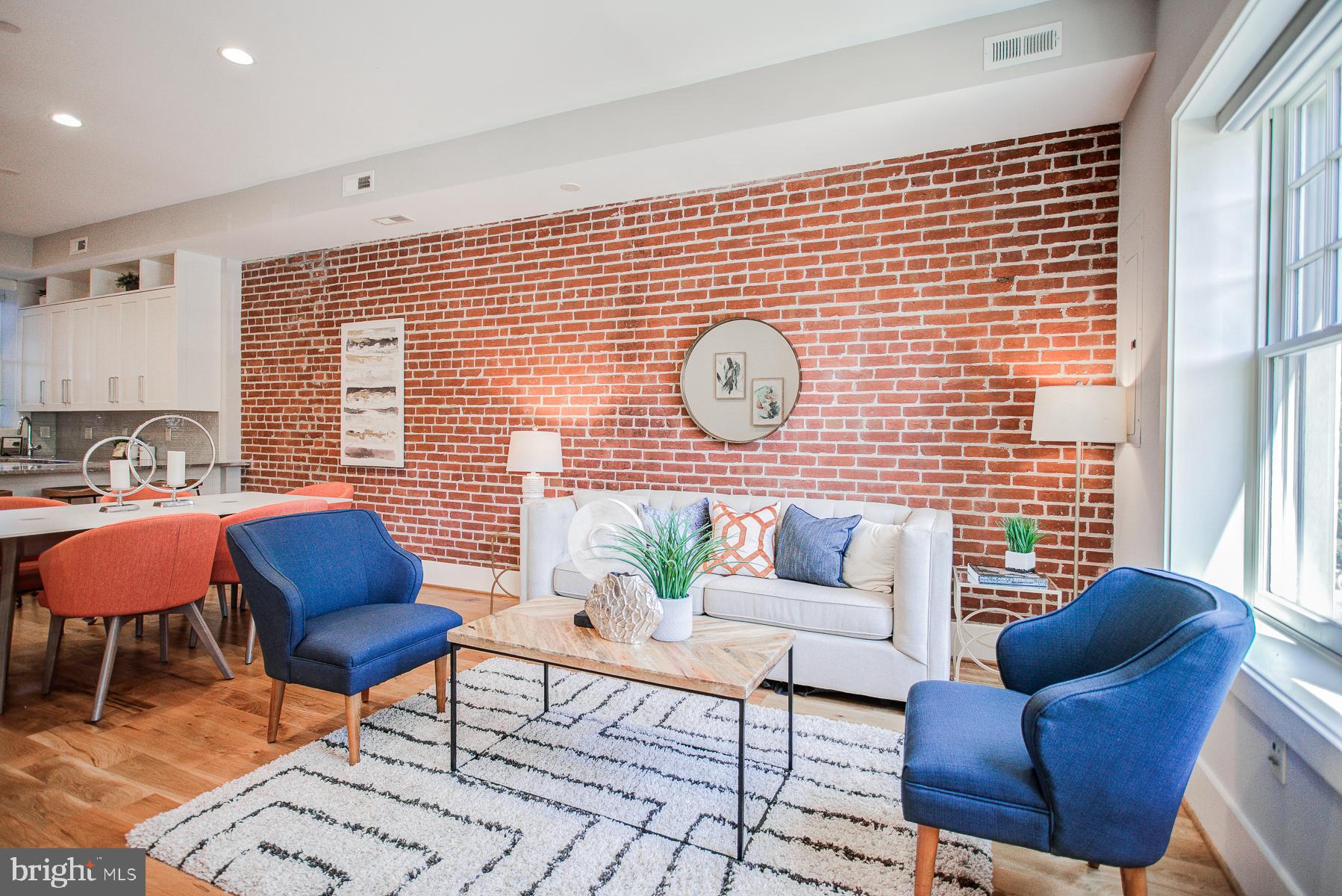 2024 16th Street Northwest, Unit C Washington, DC 20009 - Photo 5 of 27 a living room with furniture and wooden floor