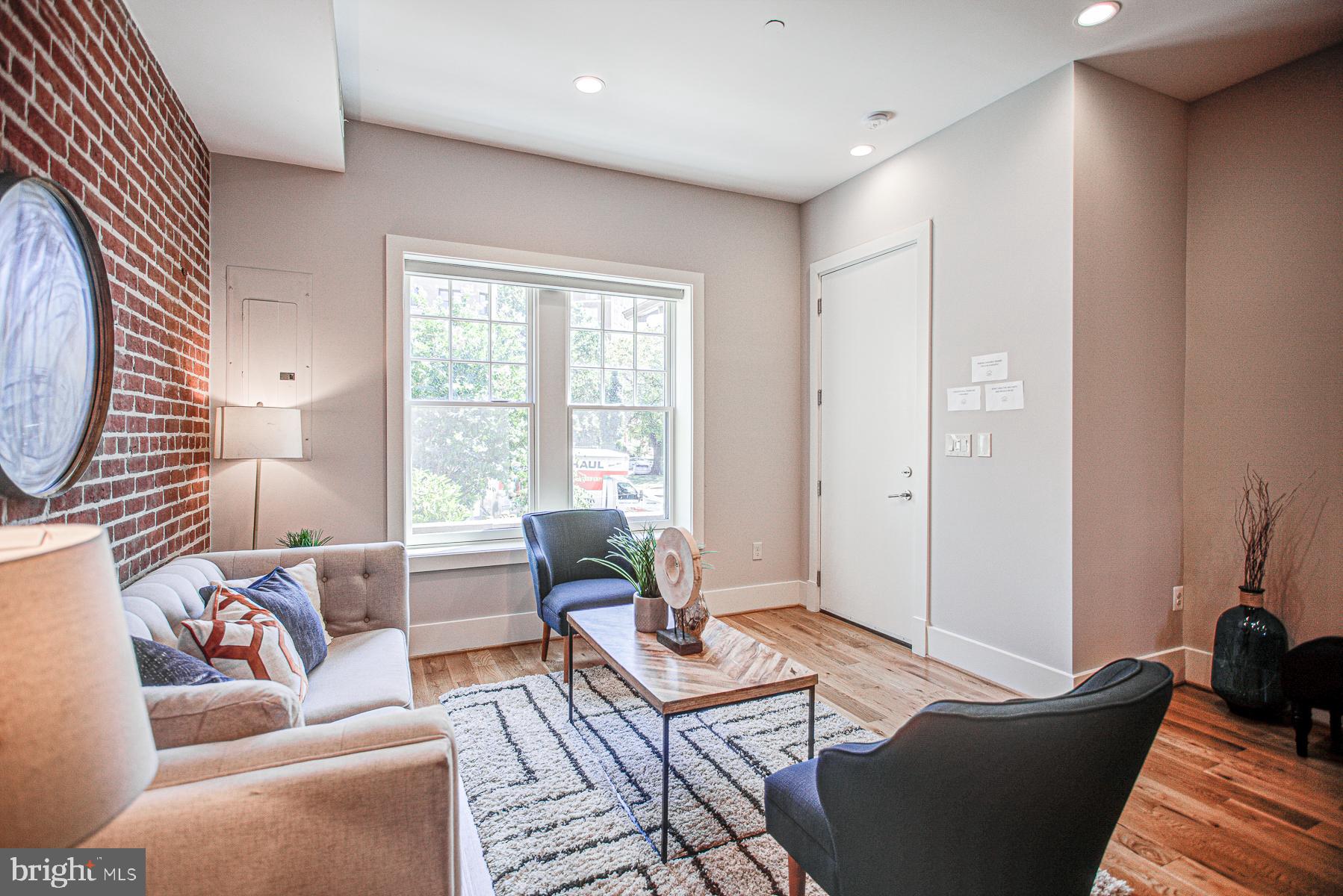 2024 16th Street Northwest, Unit C Washington, DC 20009 - Photo 7 of 27 a living room with furniture and a window