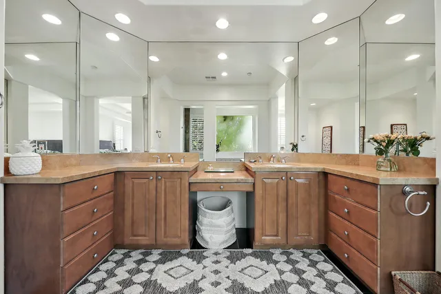 a bathroom with a sink vanity and a mirror
