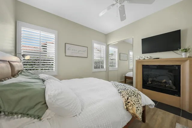 a bedroom with a bed and a television