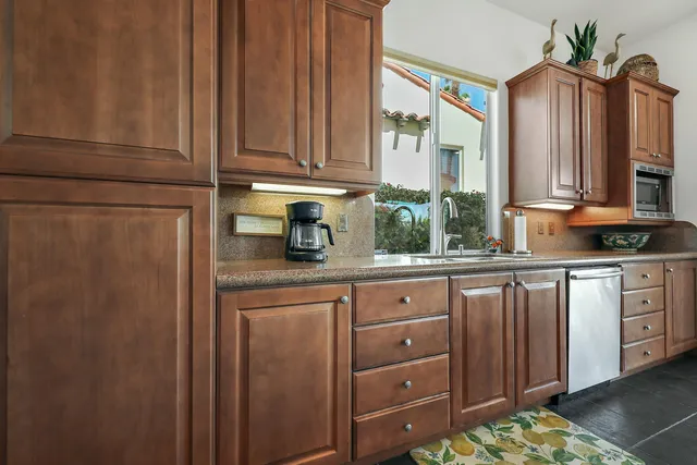 a kitchen with stainless steel appliances a refrigerator and sink