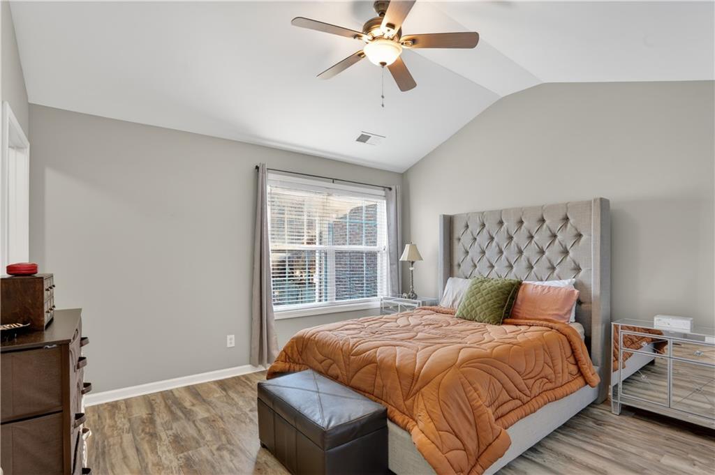 2555 Flat Shoals Road, Unit 1304 Atlanta, GA 30349 - Photo 12 of 27 a bedroom with a large bed and a window