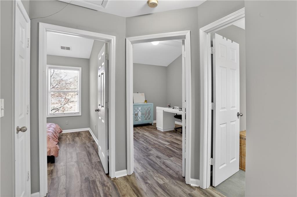2555 Flat Shoals Road, Unit 1304 Atlanta, GA 30349 - Photo 18 of 27 a view of a bathroom from a hallway