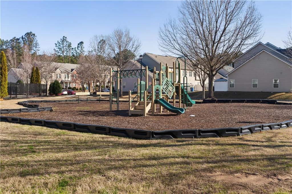 2555 Flat Shoals Road, Unit 1304 Atlanta, GA 30349 - Photo 26 of 27 a view of a playground with a houses