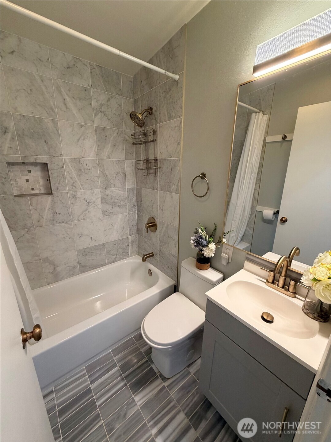 3217 East Madison Street Seattle, WA 98112 - Photo 23 of 40 a bathroom with a sink toilet and shower