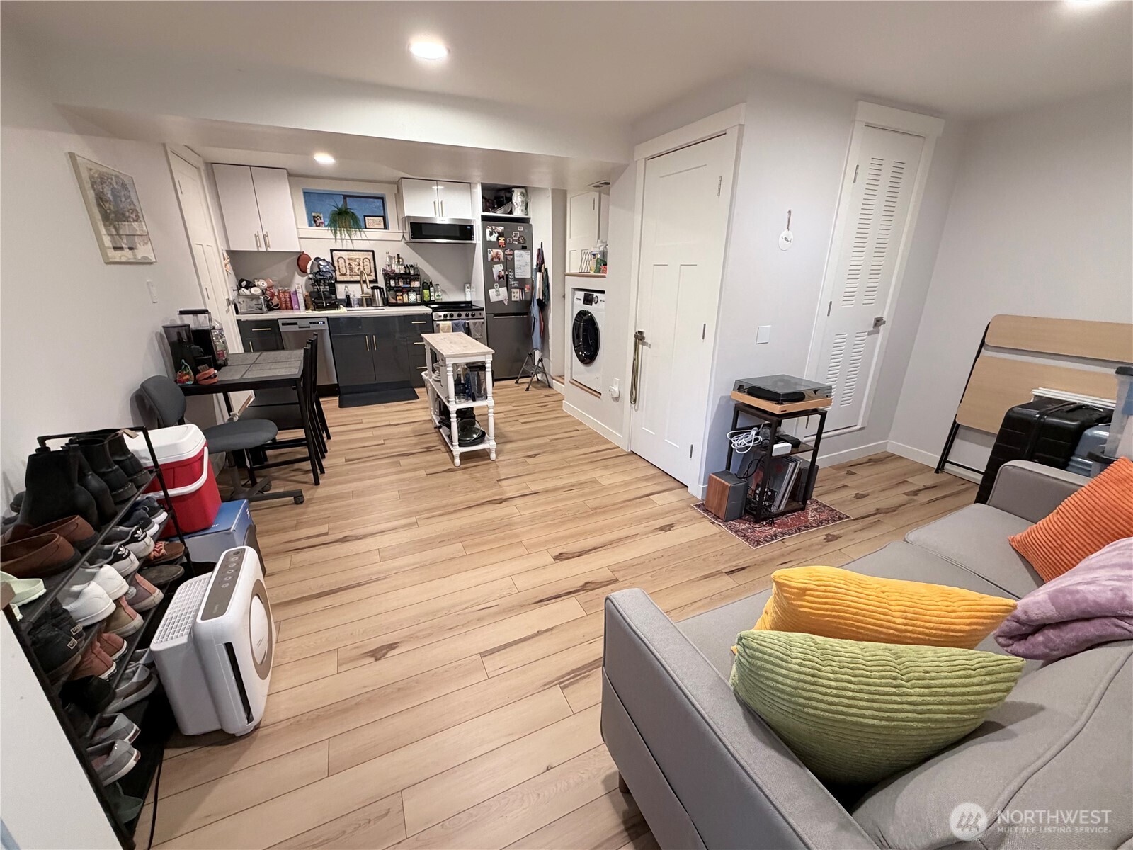 3217 East Madison Street Seattle, WA 98112 - Photo 25 of 40 a living room with furniture and wooden floor