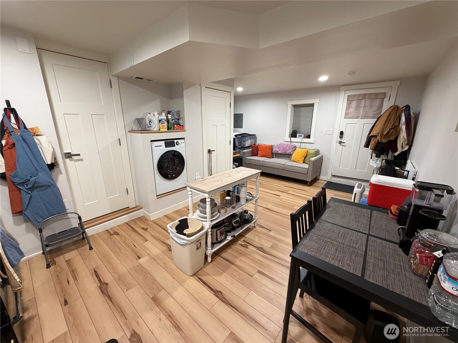 3217 East Madison Street Seattle, WA 98112 - Photo 26 of 40 a view of a workspace with furniture and wooden floor