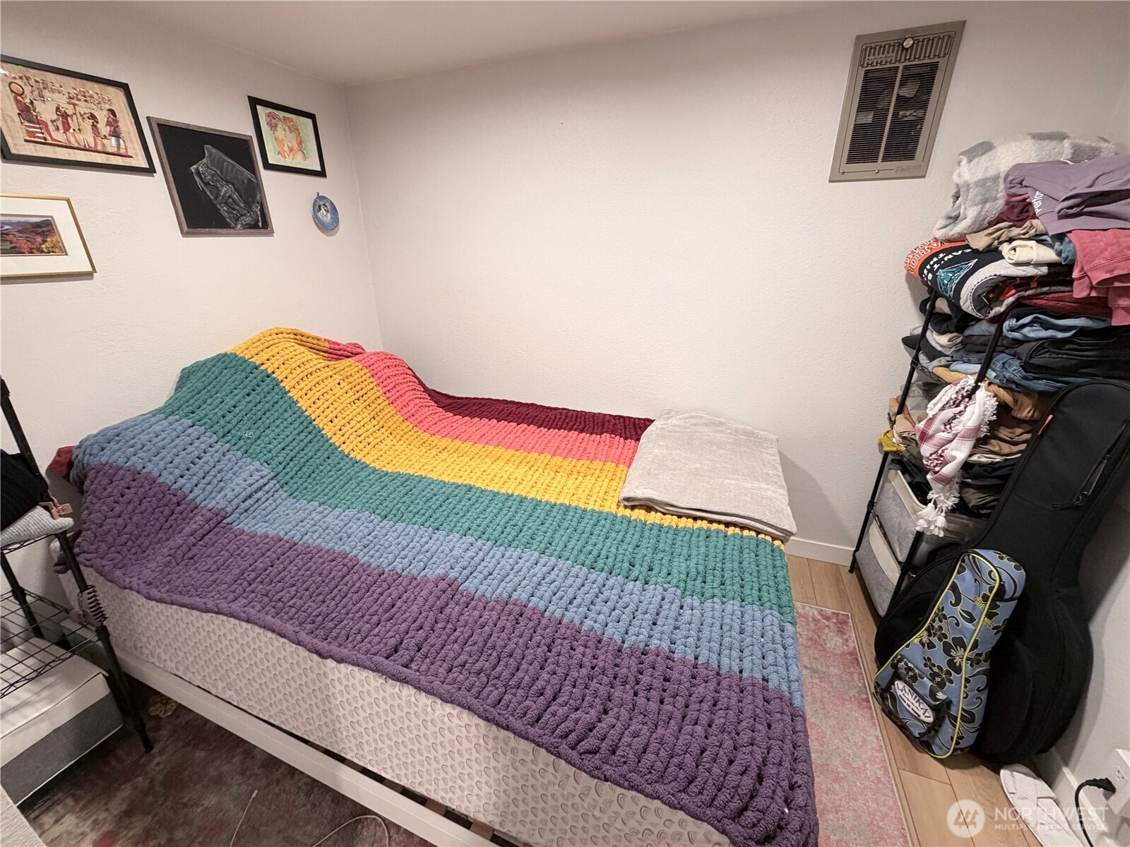 3217 East Madison Street Seattle, WA 98112 - Photo 29 of 40 a bedroom with a bed and a chair