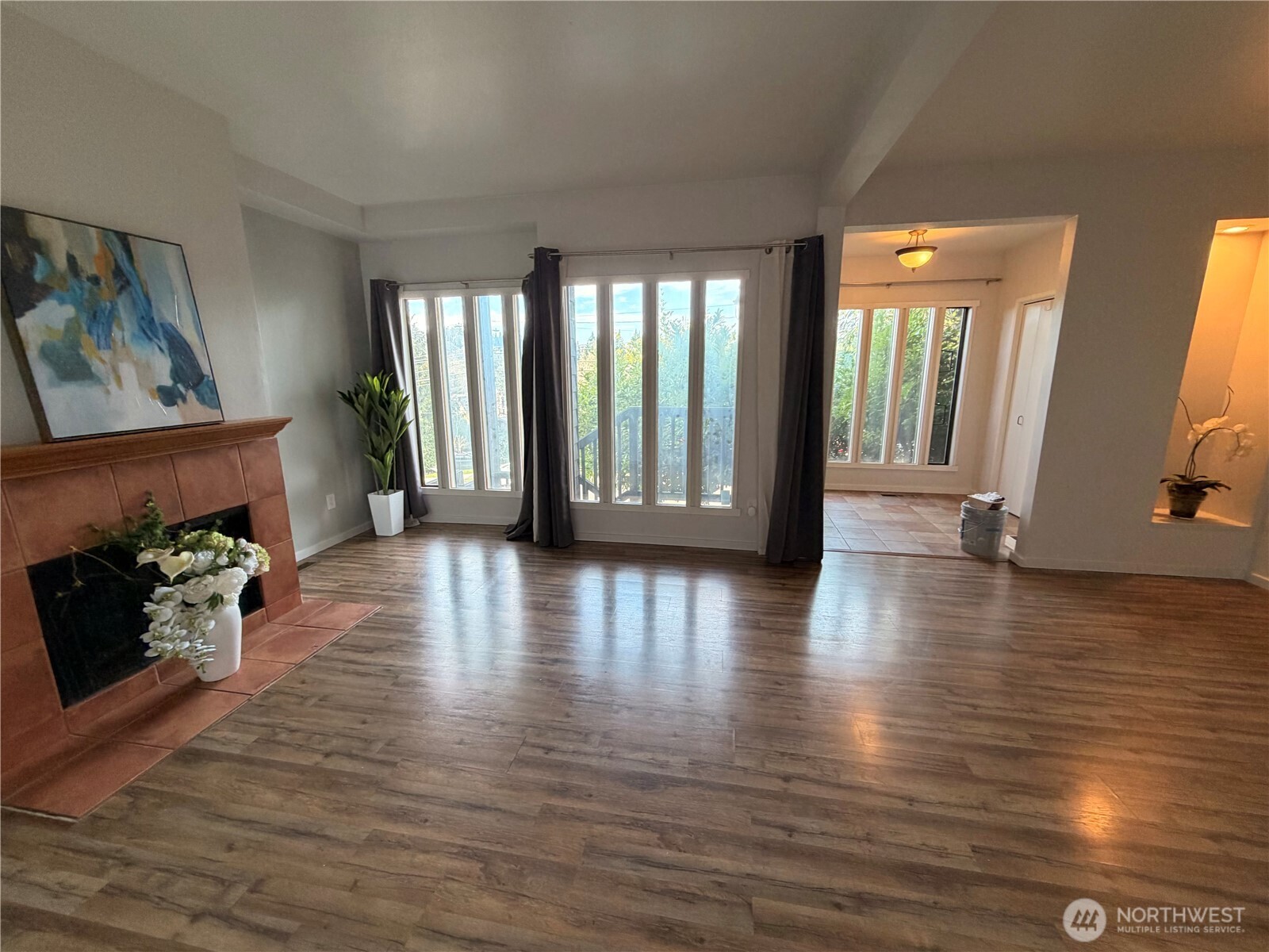 3217 East Madison Street Seattle, WA 98112 - Photo 3 of 40 a view of an empty room with wooden floor and a window