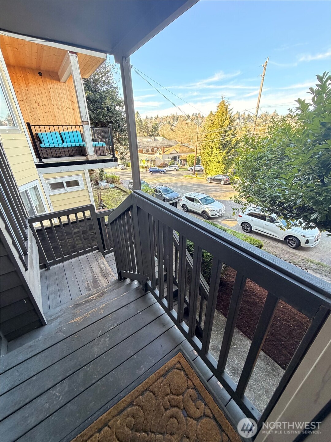 3217 East Madison Street Seattle, WA 98112 - Photo 33 of 40 a view of a balcony with wooden floor and outdoor seating