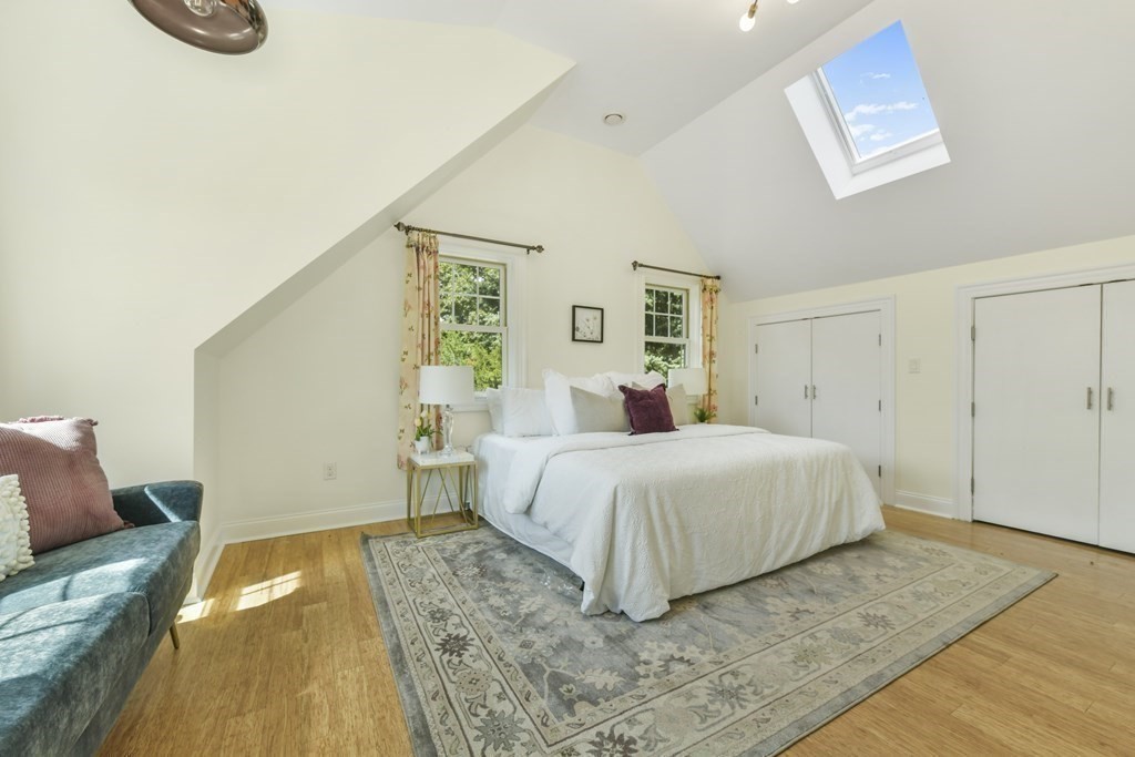 46 Spring Street, Unit 2 Somerville, MA 02143 - Photo 12 of 22 a bedroom with a bed and a table