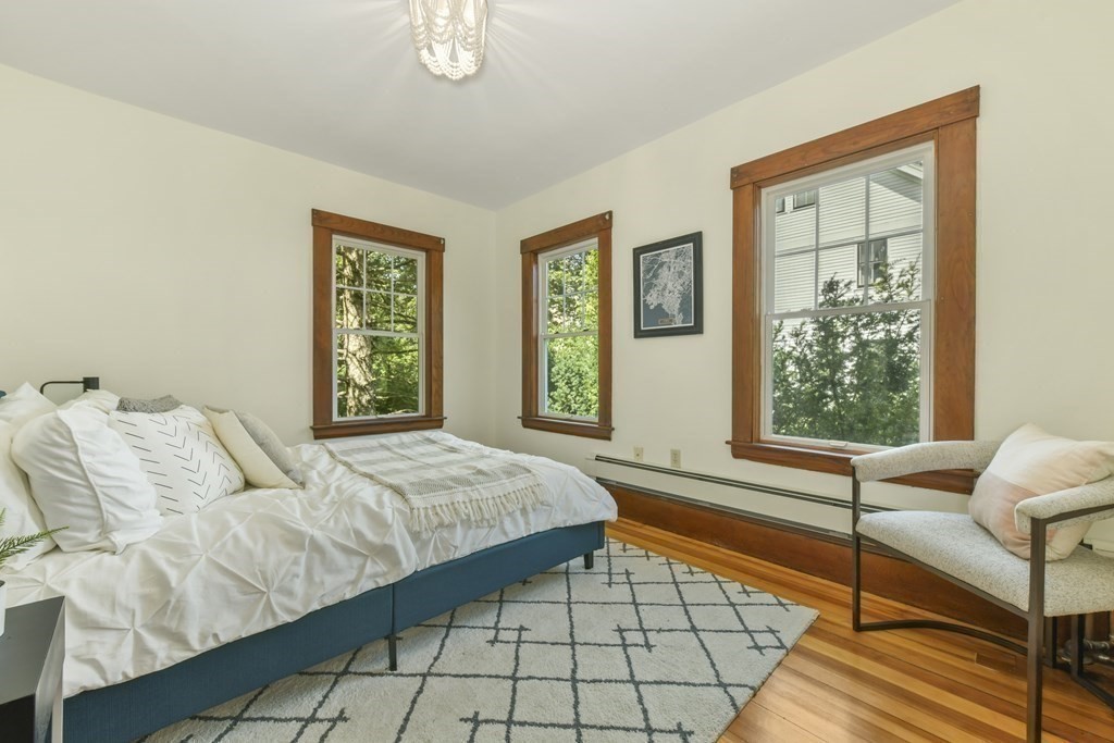 46 Spring Street, Unit 2 Somerville, MA 02143 - Photo 17 of 22 a bedroom with a bed and a window