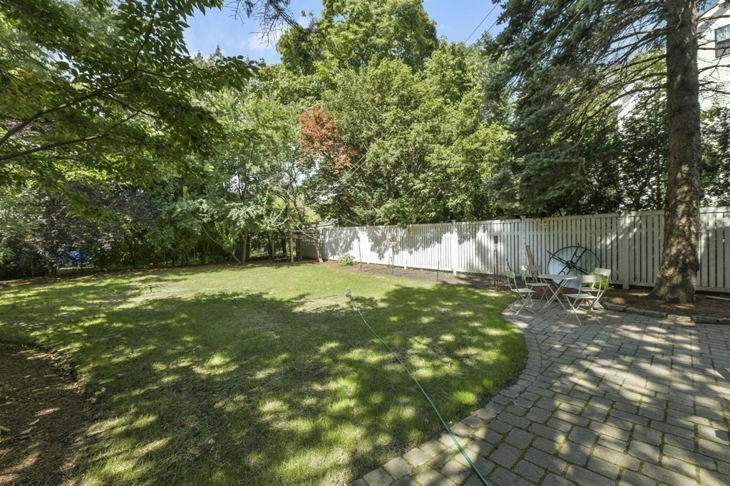 46 Spring Street, Unit 2 Somerville, MA 02143 - Photo 20 of 22 a view of a tree with a yard