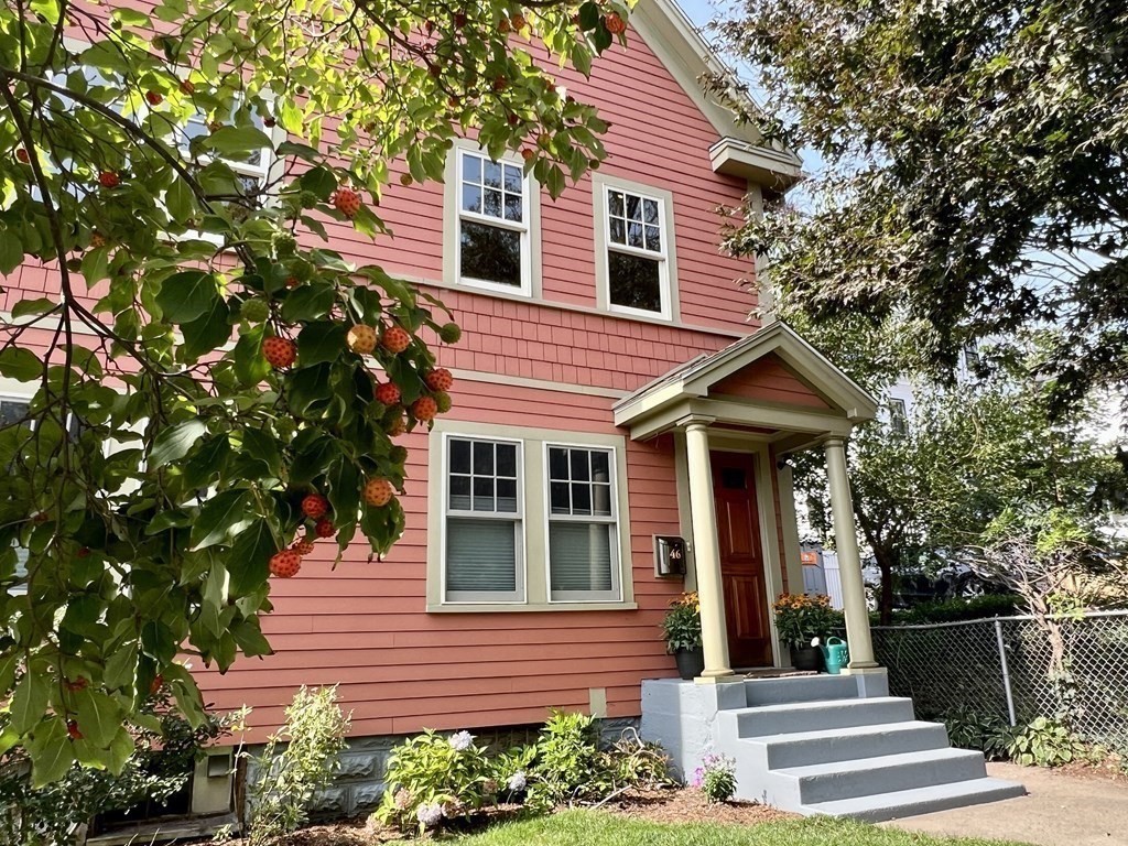 46 Spring Street, Unit 2 Somerville, MA 02143 - Photo 2 of 22 a front view of a house with a yard