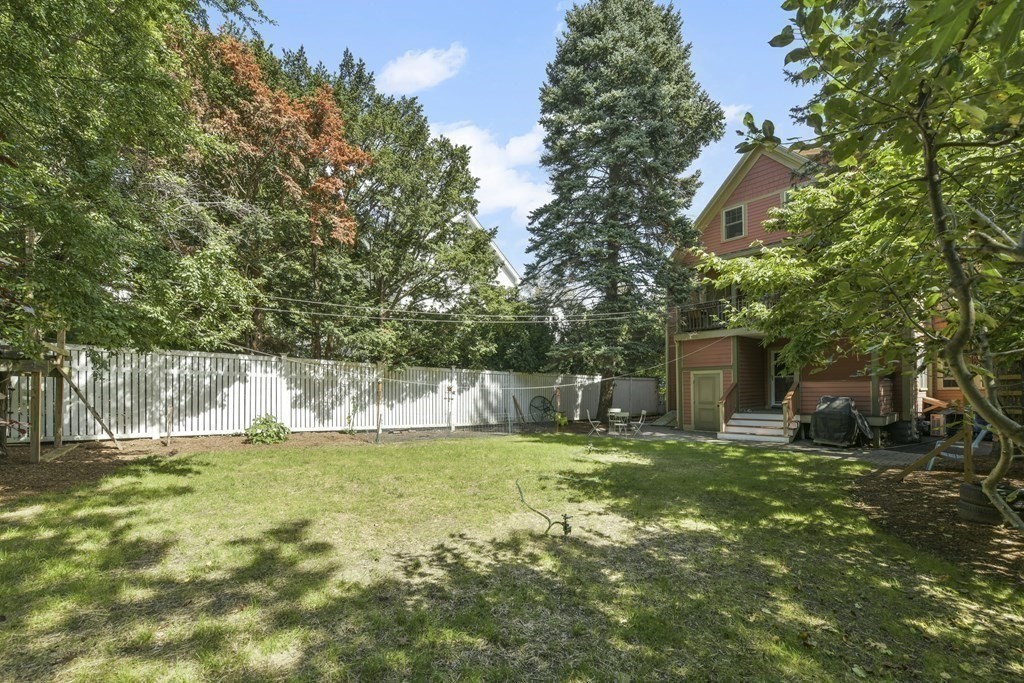 46 Spring Street, Unit 2 Somerville, MA 02143 - Photo 21 of 22 a swimming pool with outdoor seating and yard