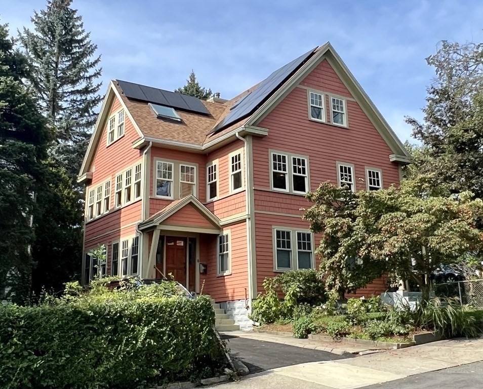 46 Spring Street, Unit 2 Somerville, MA 02143 - Photo 22 of 22 front view of a house with a yard