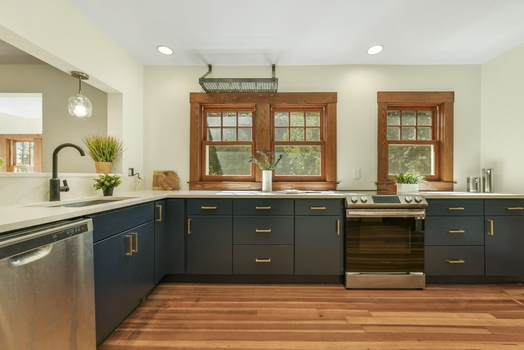 46 Spring Street, Unit 2 Somerville, MA 02143 - Photo 3 of 22 a kitchen with a sink cabinets and window