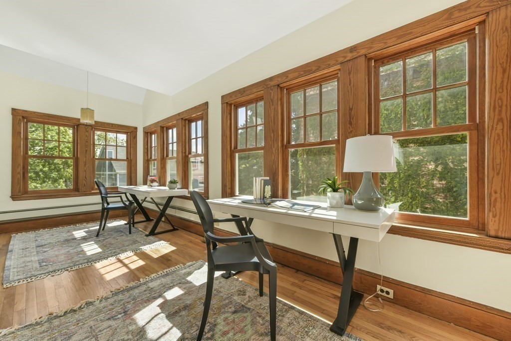 46 Spring Street, Unit 2 Somerville, MA 02143 - Photo 10 of 22 a workspace with hardwood floor and a large window