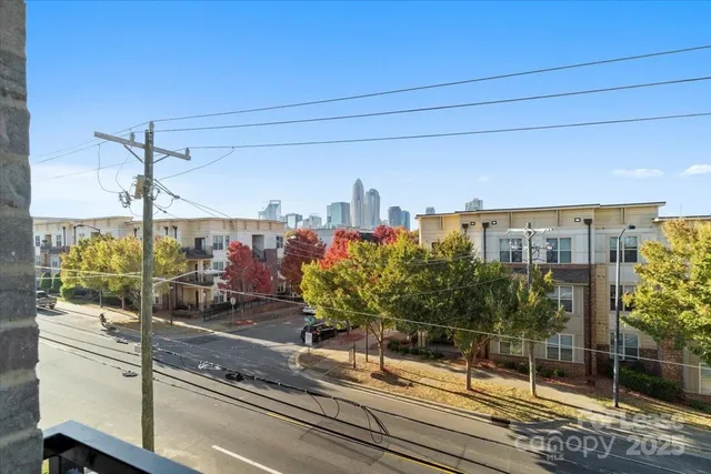 a bathroom with a sink a toilet and a large mirror