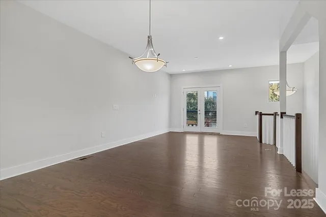 a view of an entryway with wooden floor