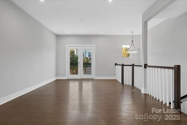 a kitchen with kitchen island a sink stainless steel appliances and cabinets