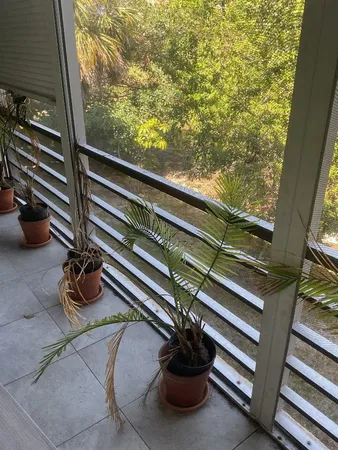 a view of a balcony with chair